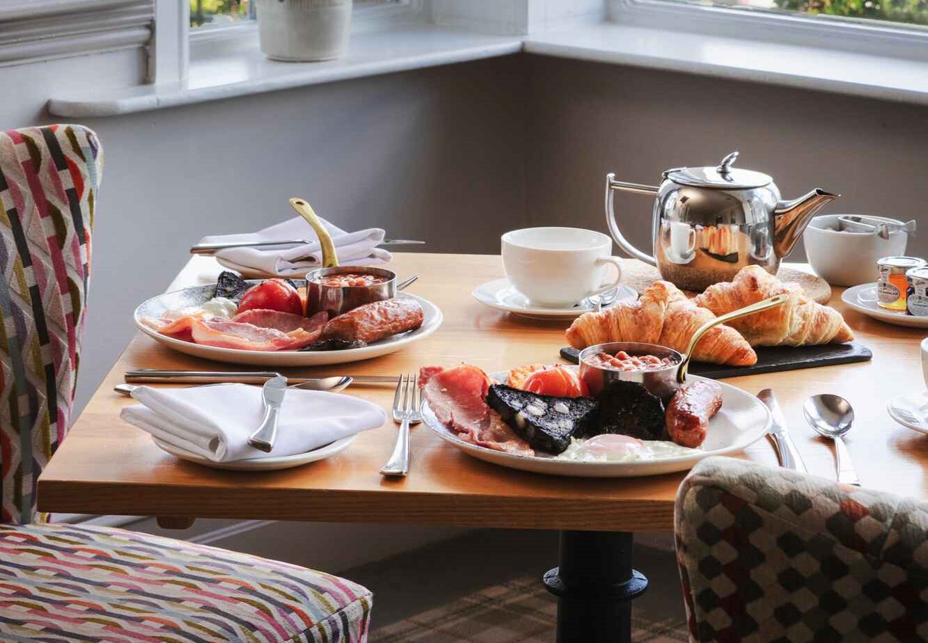 Breakfast table with bacon and eggs