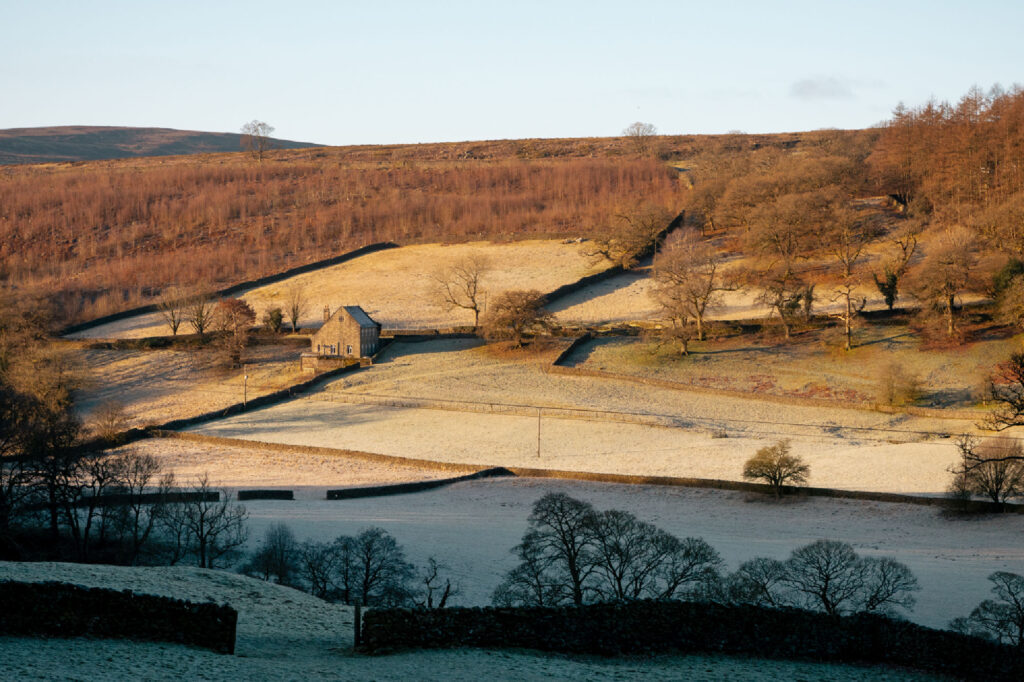 The frosty exterior of Wesleyan Cottage, sat within the hills and valley of the Dales.