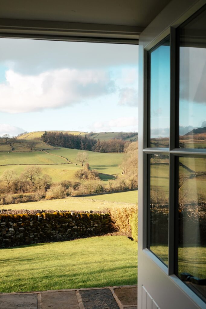 View outside the door from the living room, with valleys and rolling hills beyond.