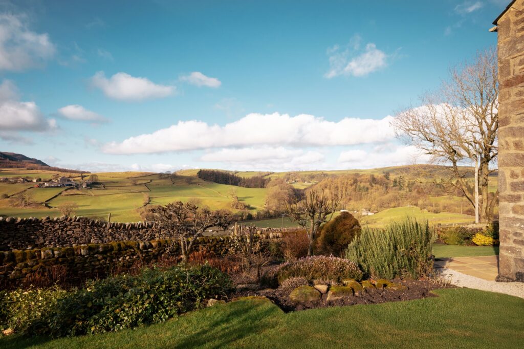 The garden of the cottage with view of the valley below.