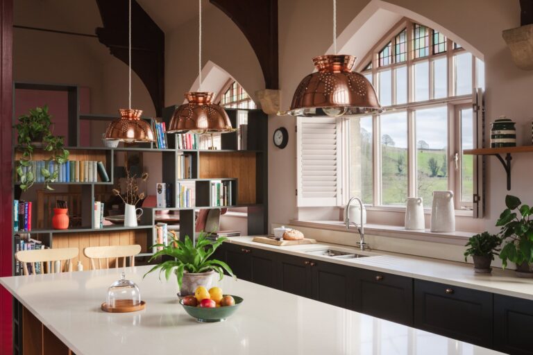 Rustic furnishings in the open plan living and dining room, with island kitchen.