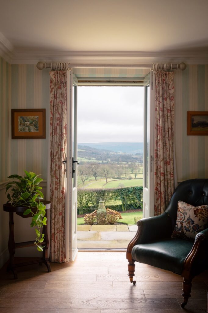 The view out to the garden from the living area, with double doors opening out.