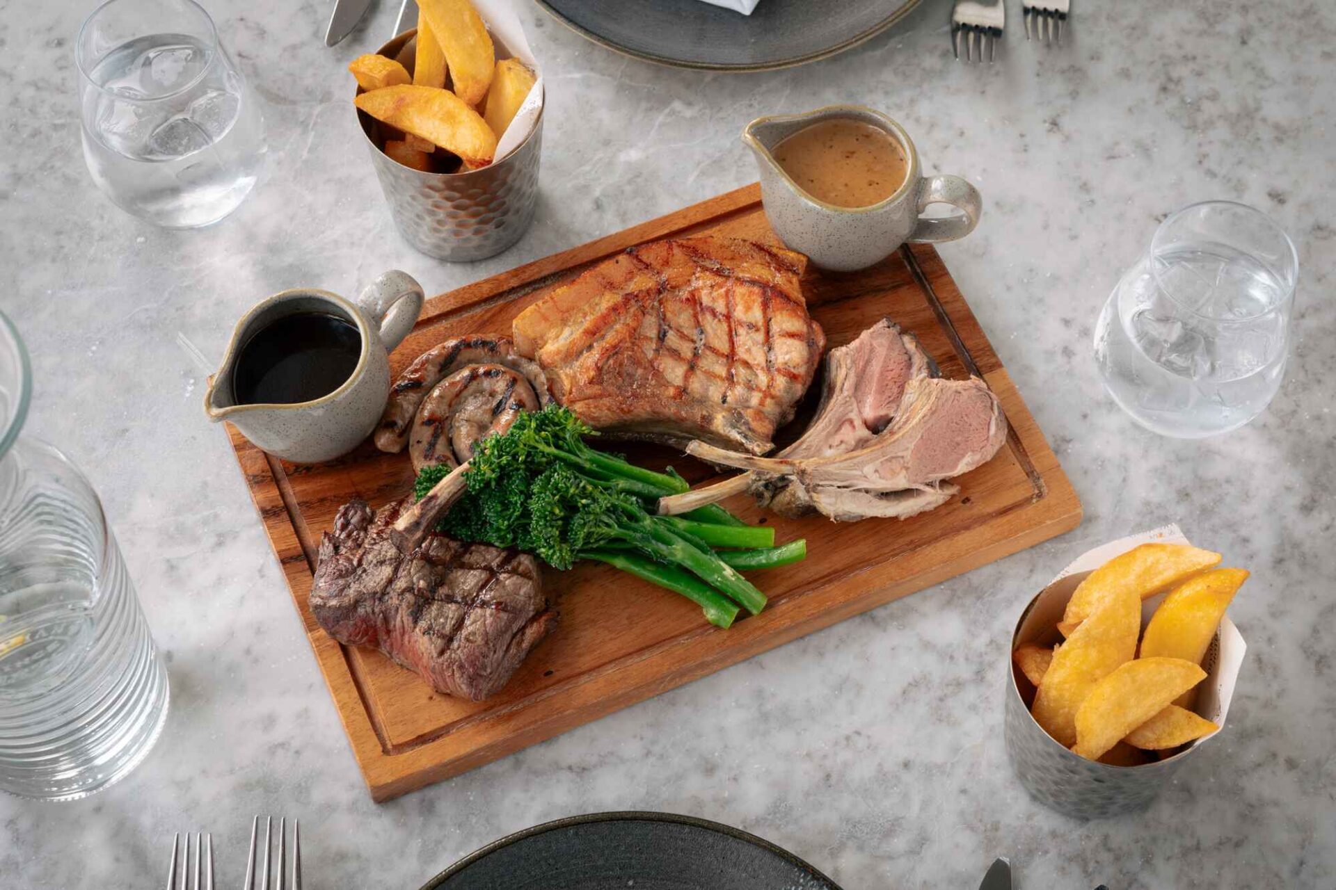image of wooden chopping board with meat and steak