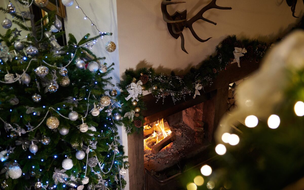 Christmas tree by fire place