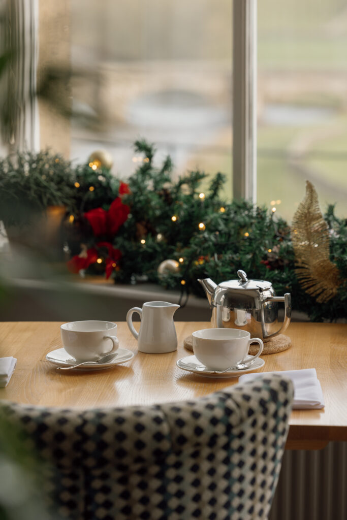 Pot of tea with a festive garland