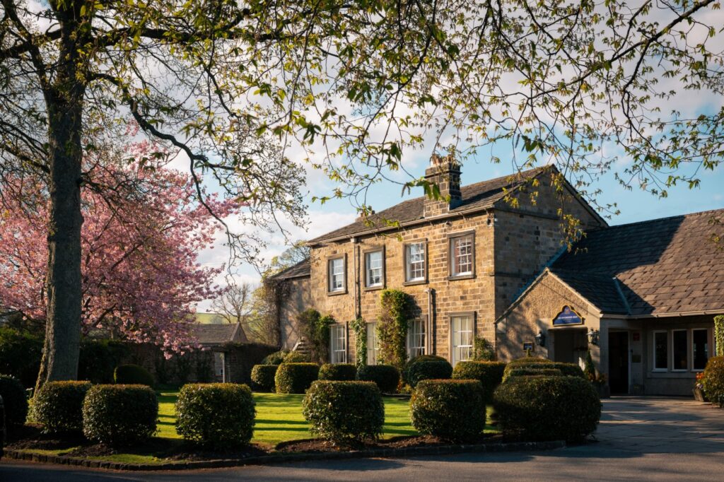 The front of The Devonshire Arms Hotel with cherry blossom trees