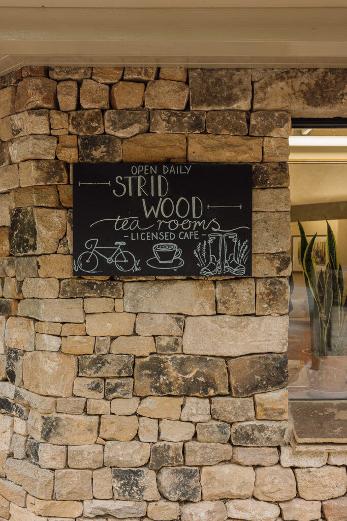 The outside of Strid Wood Tea Rooms with Yorkshire Stone and a blackboard.